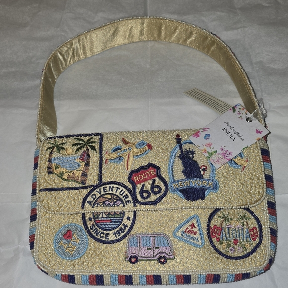 T.J.Maxx Handbags - T.J.Maxx Beaded Beige Shoulder Bag with Colorful Travel Patches